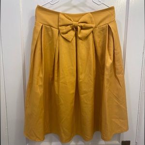 High waisted mustard skirt with bow